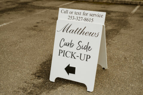 Matthews A-board sign saying Curbside Pick-up